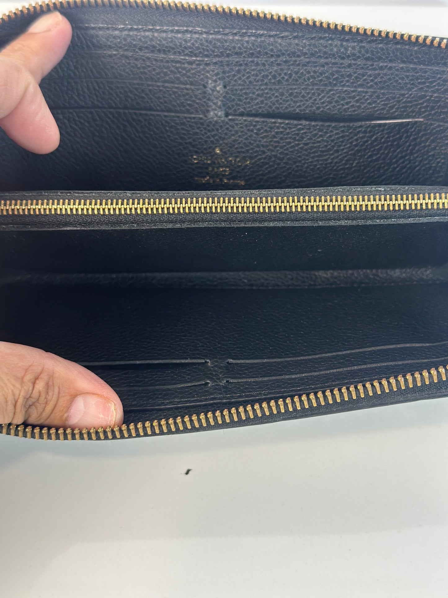 Pre-owned LOUIS VUITTON Clemence wallet in black leather with zipper