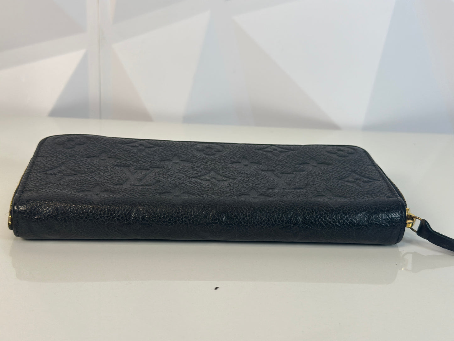 Pre-owned LOUIS VUITTON Clemence wallet in black leather with zipper