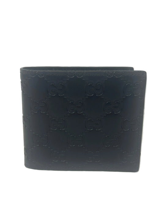 Pre-owned GUCCI GG Emblem bi-fold wallet in Black Leather _231